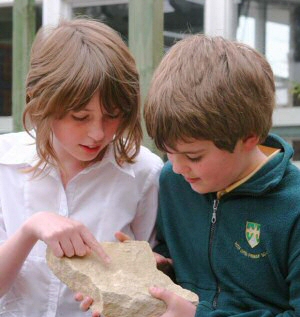 kids examining rock